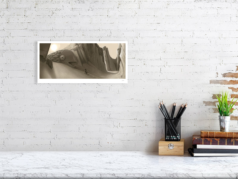 Framed photograph on a white brick wall above a desk with stationery items.